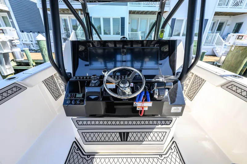Slide: The Image of 2019 Wellcraft 352 Fisherman boat console with steering wheel and controls. - 4
