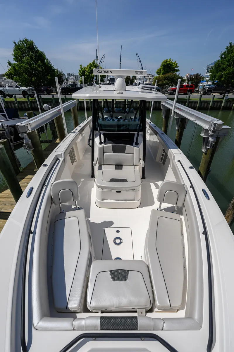 Slide: The Image of 2019 Wellcraft 352 Fisherman boat with spacious seating and modern design at a dock. - 7