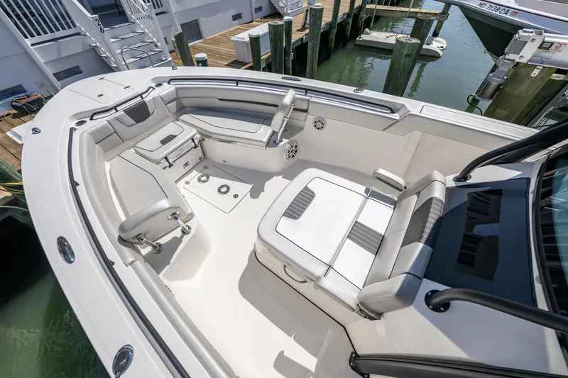 Slide: The Image of 2019 Wellcraft 352 Fisherman boat interior with cushioned seating and storage compartments. - 8