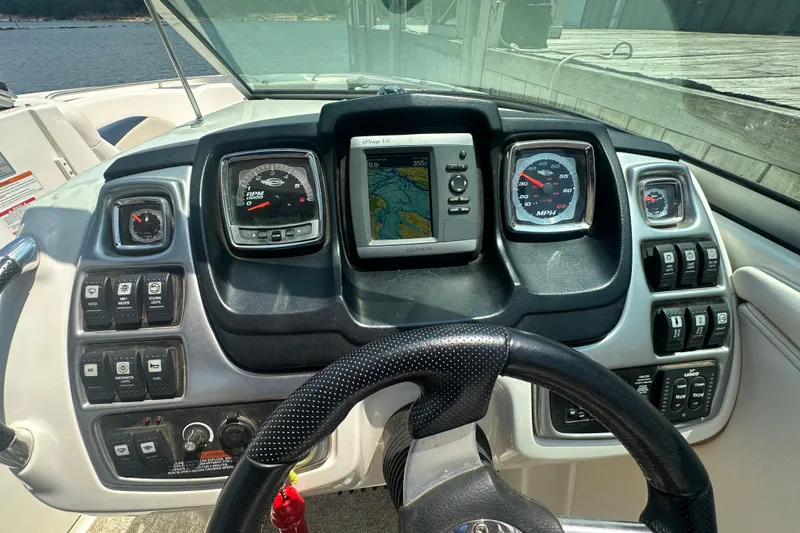 Slide: The Image of Dashboard of a 2011 Chaparral 287 SSX boat with navigation and control panels. - 22
