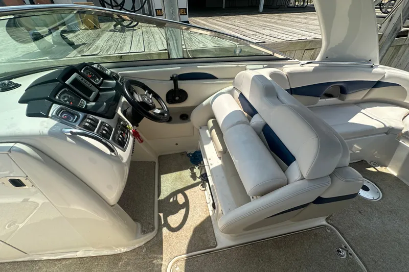 Slide: The Image of 2011 Chaparral 287 SSX boat interior with steering console and seating area. - 25