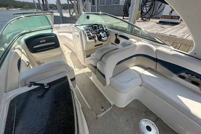 Slide: The Image of Interior of a 2011 Chaparral 287 SSX boat with plush seating and modern dashboard. - 26