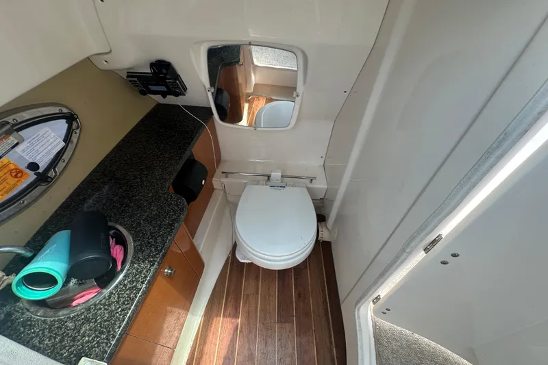 Slide: The Image of Interior of 2011 Chaparral 287 SSX boat bathroom with toilet and sink. - 32