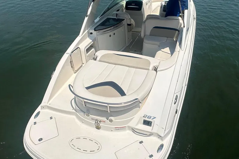 Slide: The Image of 2011 Chaparral 287 SSX boat with spacious seating on calm water. - 8