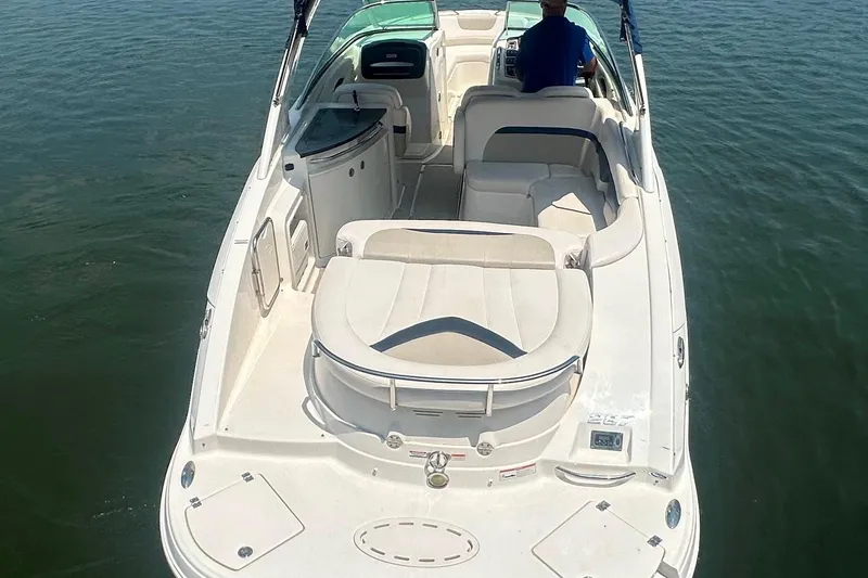 Slide: The Image of 2011 Chaparral 287 SSX boat on water, featuring spacious seating and sleek design. - 9