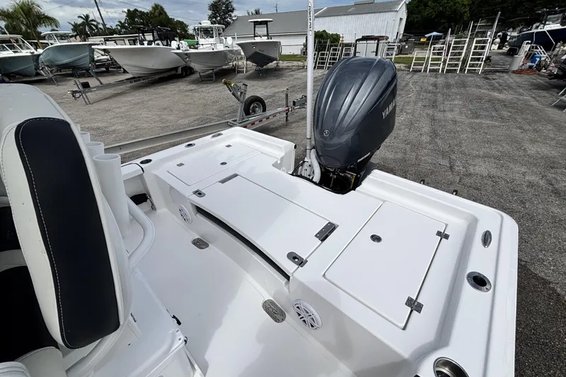 Slide: The Image of 2026 Tidewater 2410 Bay Max boat with Yamaha outboard motor in a marina setting. - 11