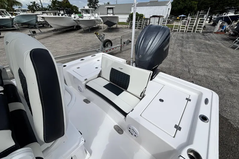 Slide: The Image of 2026 Tidewater 2410 Bay Max boat with Yamaha engine, docked in a marina. - 12