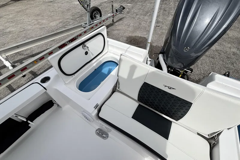 Slide: The Image of 2026 Tidewater 2410 Bay Max boat interior with seating and storage compartments. - 14
