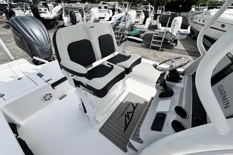 Slide: The Image of 2026 Tidewater 2410 Bay Max boat interior with dual seats and steering console. - 18