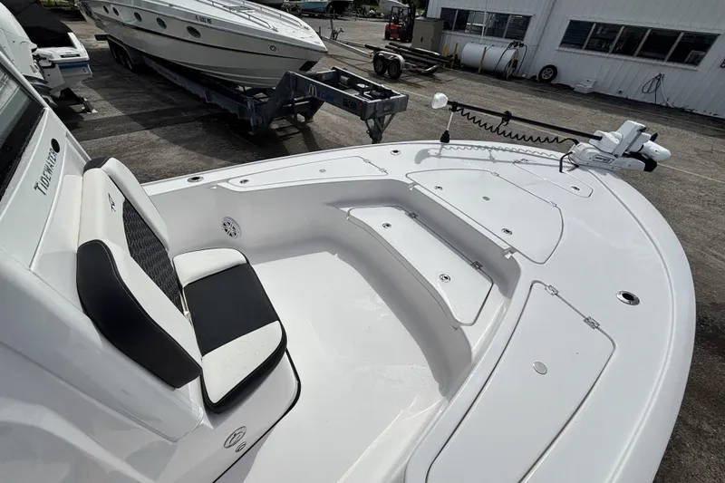 Slide: The Image of 2026 Tidewater 2410 Bay Max boat interior with seating and storage compartments. - 27