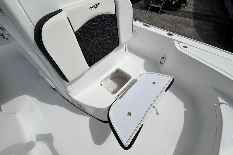 Slide: The Image of 2026 Tidewater 2410 Bay Max boat seat with storage compartment open. - 29