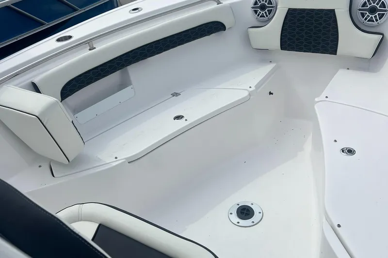 Slide: The Image of 2025 Tidewater 232 LXF boat interior with white seating and modern design. - 14