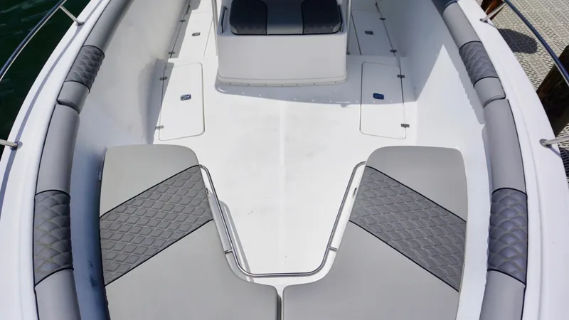 Slide: The Image of Century 3100 boat interior, 2000 model, featuring gray cushioned seating and spacious deck layout. - 10