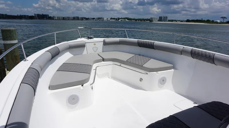 Slide: The Image of Bow seating area on a 2000 Century 3100 boat, with gray cushions and ocean view. - 7