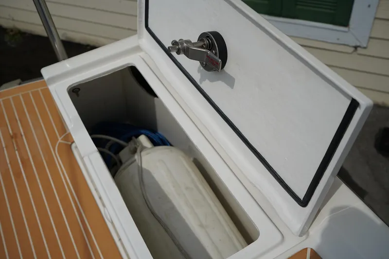 Slide: The Image of Open storage compartment on 2024 Nimbus Commuter9 C9 boat, showing interior equipment. - 11