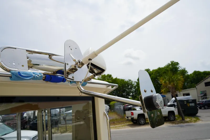 Slide: The Image of Antenna and equipment on 2024 Nimbus Commuter9 C9 boat, parked outdoors. - 12