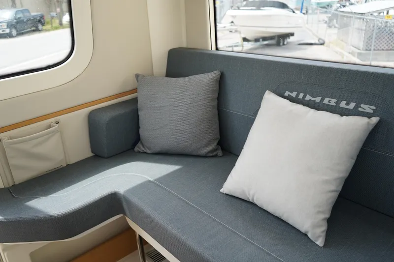 Slide: The Image of Interior seating of 2024 Nimbus Commuter9 C9 with cushions and window view. - 17