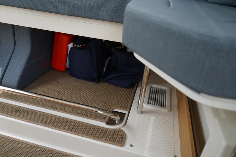 Slide: The Image of Interior storage area of 2024 Nimbus Commuter9 C9 boat with cushions and bags. - 19