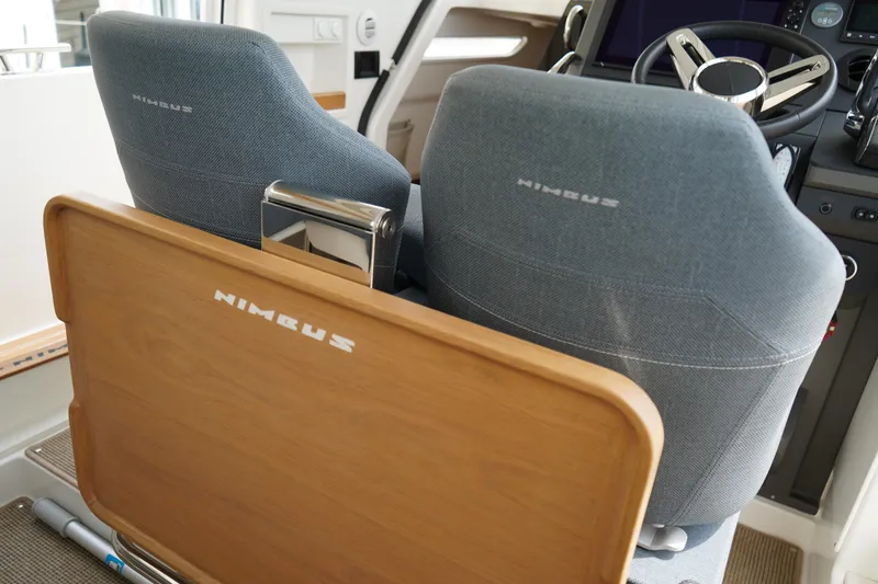 Slide: The Image of 2024 Nimbus Commuter9 C9 interior with steering wheel and branded seats. - 20