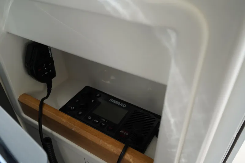 Slide: The Image of 2024 Nimbus Commuter9 C9 featuring a Simrad marine radio system. - 38