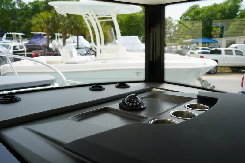 Slide: The Image of Interior view of 2024 Nimbus Commuter9 C9 boat with compass and cup holders. - 39