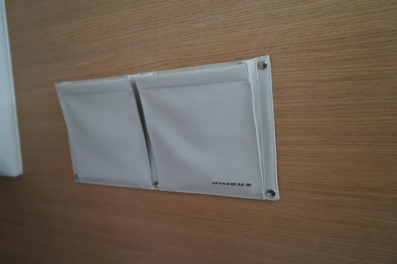 Slide: The Image of White fabric pockets on wooden panel, Nimbus Commuter9 C9, 2024 model. - 43