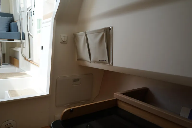 Slide: The Image of Interior of 2024 Nimbus Commuter9 C9 boat, featuring seating and storage compartments. - 44