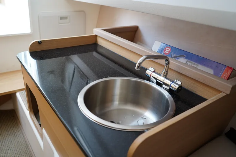 Slide: The Image of 2024 Nimbus Commuter9 C9 interior sink with modern faucet and sleek countertop design. - 46