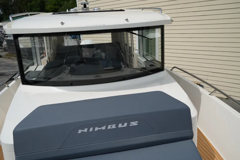 Slide: The Image of 2024 Nimbus Commuter9 C9 boat with sleek design and spacious deck. - 48