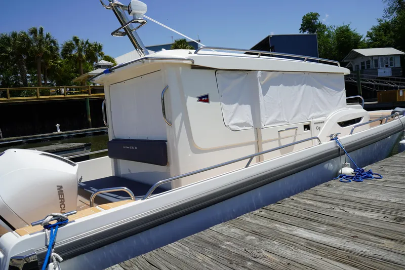 Slide: The Image of 2024 Nimbus Commuter9 C9 boat docked, featuring sleek design and modern amenities. - 8