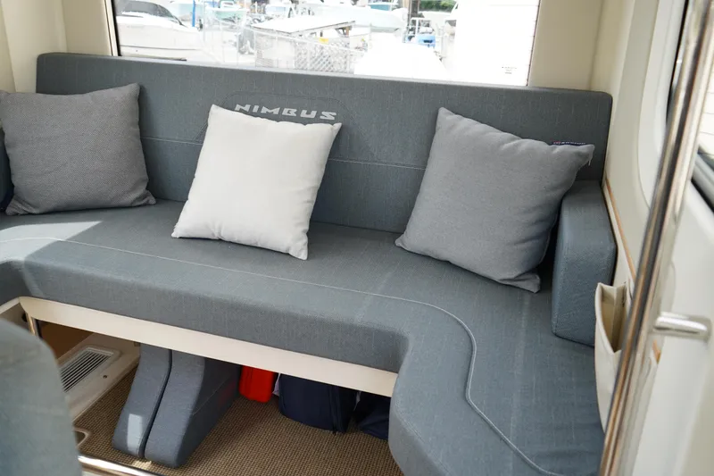 Slide: The Image of 2024 Nimbus Commuter9 C9 interior with gray seating and cushions. - 18