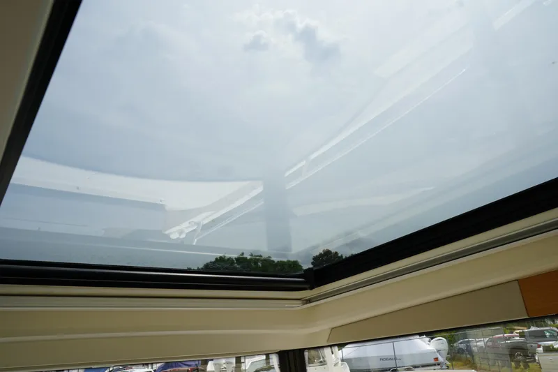 Slide: The Image of Sunroof view from 2024 Nimbus Commuter9 C9, showcasing clear sky and outdoor scenery. - 25