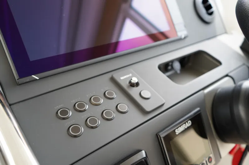 Slide: The Image of Control panel of 2024 Nimbus Commuter9 C9 boat with touchscreen and buttons. - 33