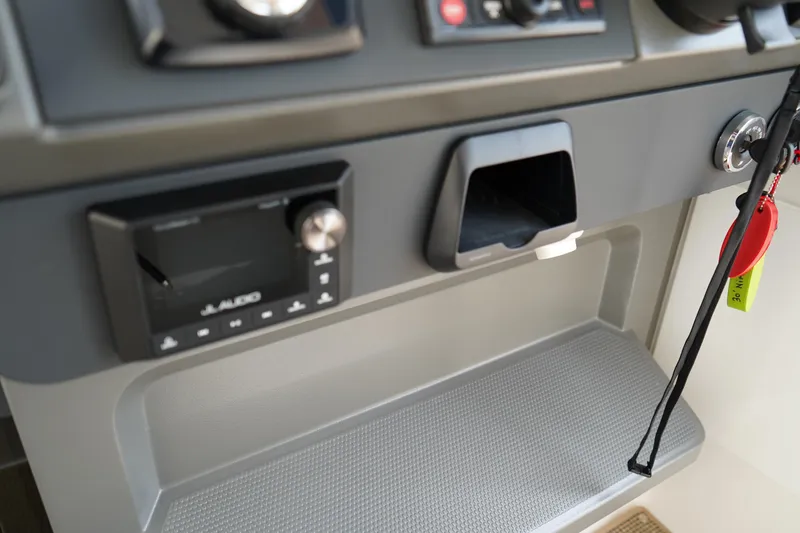 Slide: The Image of 2024 Nimbus Commuter9 C9 dashboard with JL Audio system and key holder. - 35