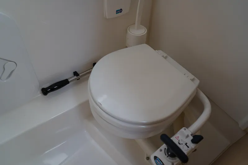 Slide: The Image of 2024 Nimbus Commuter9 C9 bathroom with compact toilet and handle. - 41