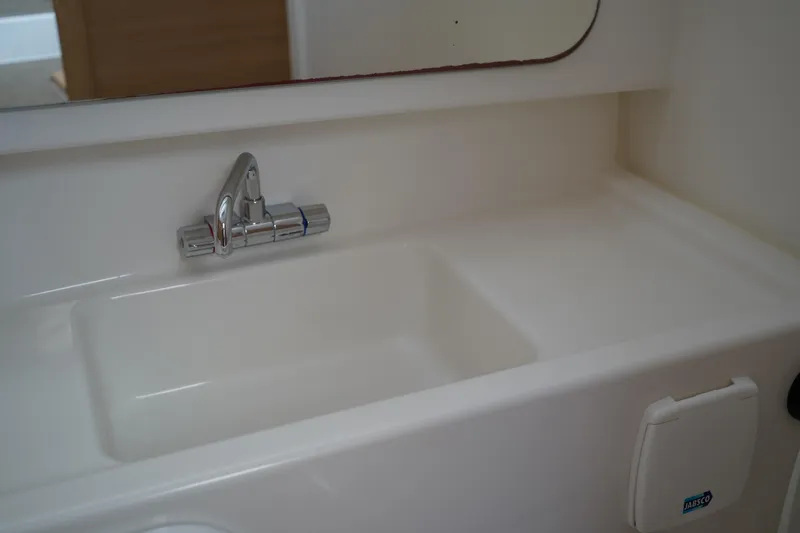 Slide: The Image of 2024 Nimbus Commuter9 C9 bathroom sink with chrome faucet and integrated mirror. - 42