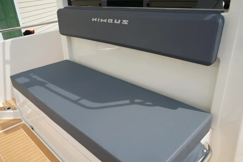 Slide: The Image of 2024 Nimbus Commuter9 C9 boat seat with gray cushions. - 9