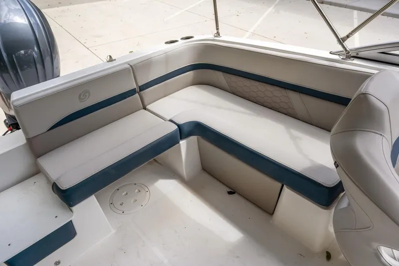 Slide: The Image of 2025 Hurricane SunDeck 217 OB boat interior with cushioned seating and modern design. - 10