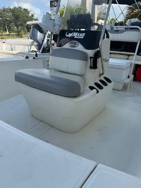 Slide: The Image of 2023 Mako Pro Skiff 17 CC boat interior with seating and console. - 12