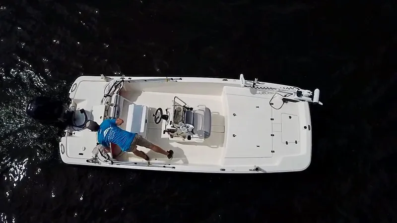 Slide: The Image of Overhead view of 2023 Mako Pro Skiff 17 CC boat on water. - 4