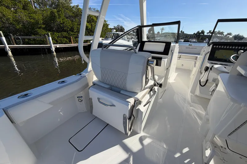 Slide: The Image of 2026 World Cat 265 DC-X boat interior with modern seating and control panel. - 12