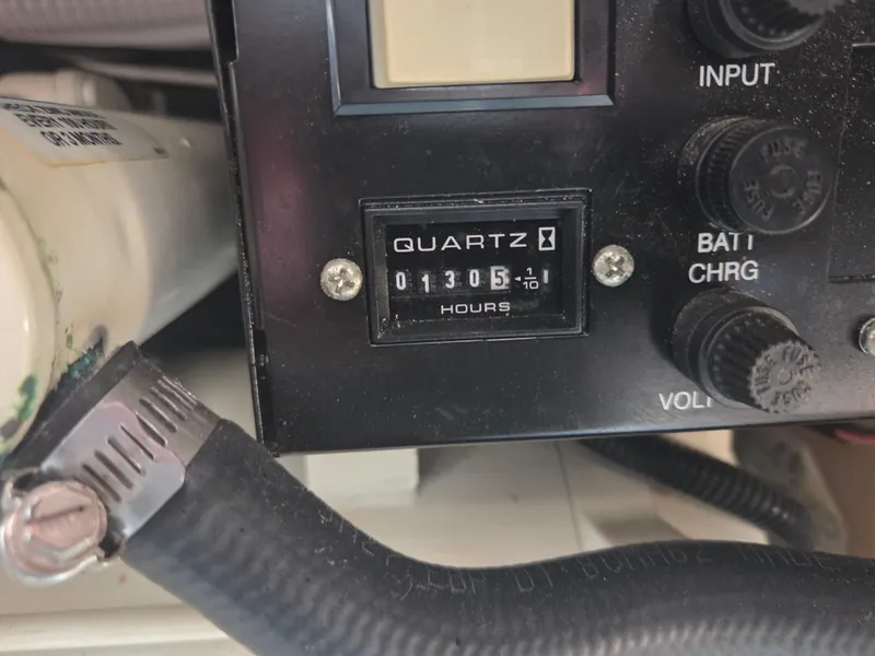 Slide: The Image of Hour meter reading 1305 on 2004 Sea Ray 280 Sundancer control panel. - 21