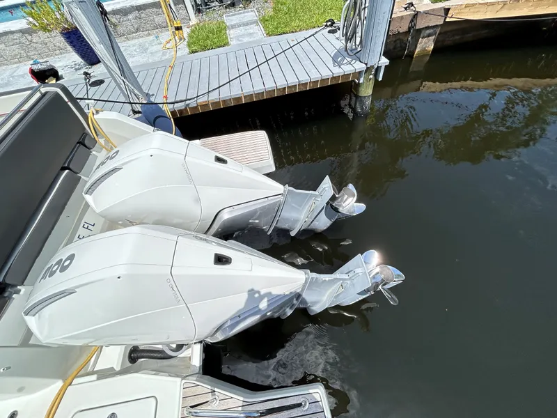 Slide: The Image of Twin outboard engines on a 2022 Jeanneau Leader 10.5 WA Series 2 boat at dock. - 17
