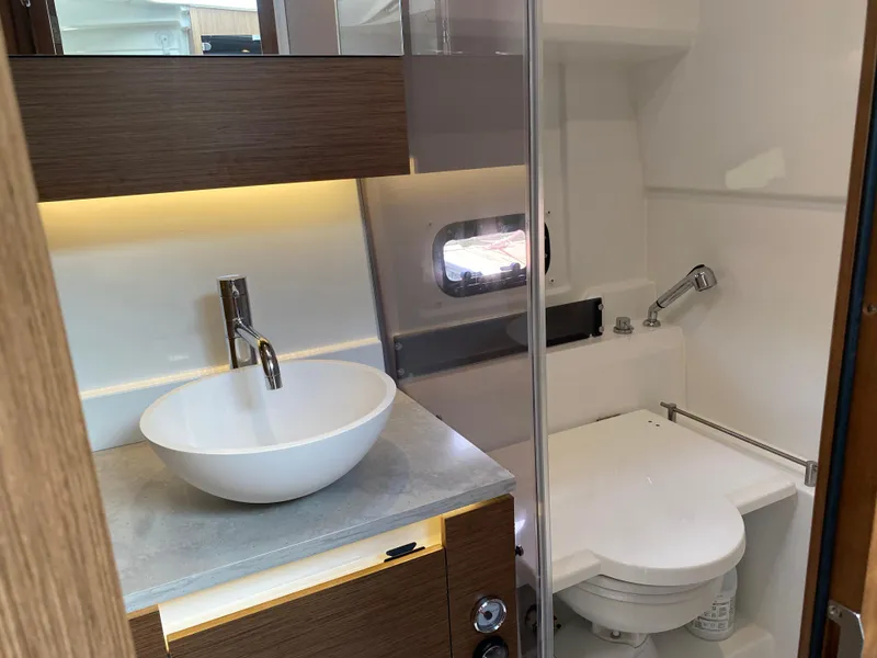 Slide: The Image of Modern bathroom in 2022 Jeanneau Leader 10.5 WA Series 2 boat, featuring sink and toilet. - 23