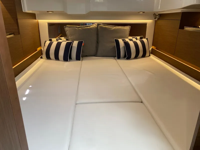 Slide: The Image of Interior cabin of 2022 Jeanneau Leader 10.5 WA Series 2 with striped cushions. - 24