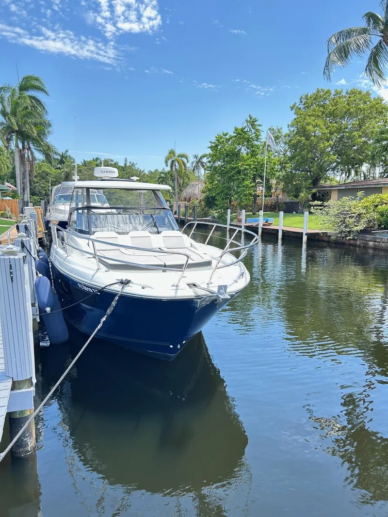 Slide: The Image of 2022 Jeanneau Leader 10.5 WA Series 2 docked in a scenic canal setting. - 3