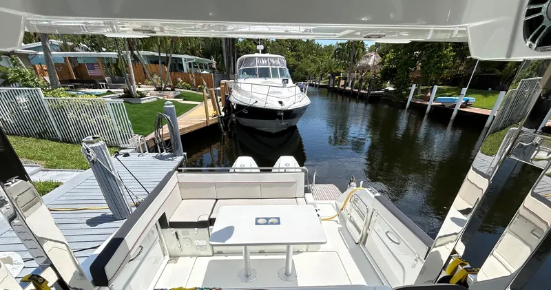 Slide: The Image of 2022 Jeanneau Leader 10.5 WA Series 2 docked in a scenic canal setting. - 6