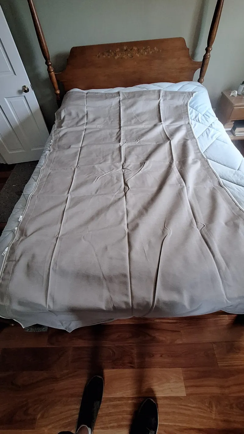 Slide: The Image of Beige bed cover on wooden bed frame in a cozy bedroom setting. - 37
