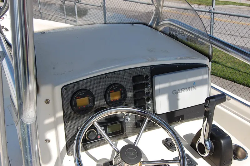 Slide: The Image of Control panel of a 2006 Scout 240 boat with Garmin navigation system. - 11