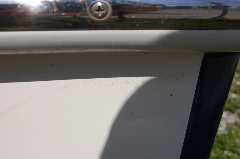 Slide: The Image of Close-up of a 2006 Scout 240 boat hull identification number. - 18